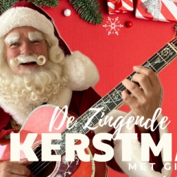 de Zingende Kerstman met gitaar