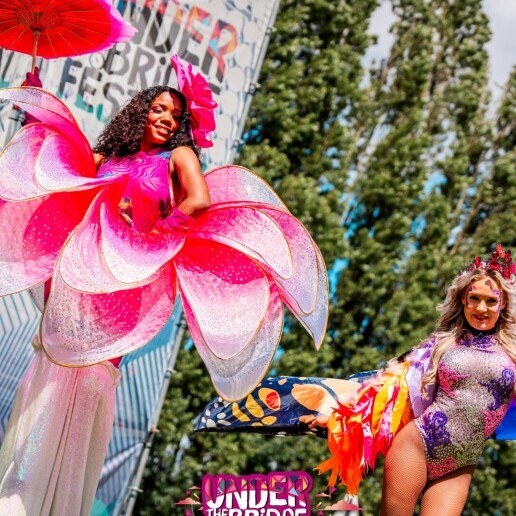 Festival stilt walkers in theme