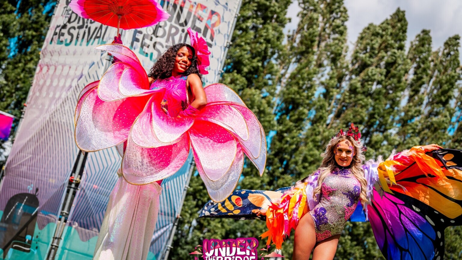 Festival stilt walkers in theme