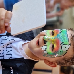 Priscilla's face painting and glitter tattoos