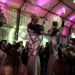 Roaring Ladies stilt walkers