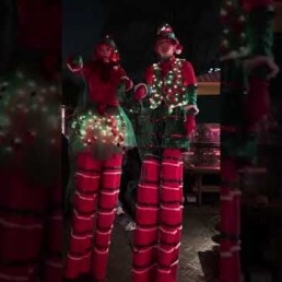 Christmas elves on stilts